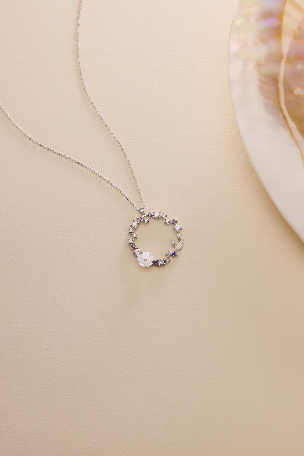 Rhodium Magnolia Necklace | Sterling Silver Circle Pendant | Zircon Jewelry